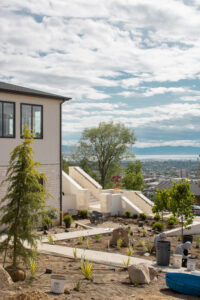 As seen in the 2025 Utah Valley Parade of Homes, this 13-tiered planter bed retaining wall stands as a testament to modern landscaping excellence. Its design not only supports the terrain but also creates a captivating garden feature.