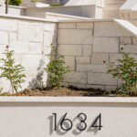 Our 13-step planter bed retaining wall, showcased at the 2025 Utah Valley Parade of Homes, demonstrates a perfect blend of durability and design. This structure offers a practical solution for sloped terrains while adding a touch of sophistication.