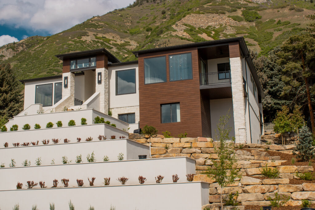 Our 13-step planter bed retaining wall, showcased at the 2025 Utah Valley Parade of Homes, demonstrates a perfect blend of durability and design. This structure offers a practical solution for sloped terrains while adding a touch of sophistication.