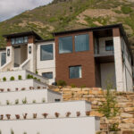 Our 13-step planter bed retaining wall, showcased at the 2025 Utah Valley Parade of Homes, demonstrates a perfect blend of durability and design. This structure offers a practical solution for sloped terrains while adding a touch of sophistication.