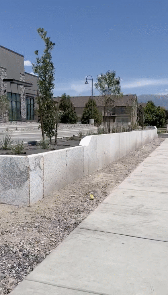 EPS foam blocks stacked and shaped on-site as part of Saratoga Springs retaining wall project
