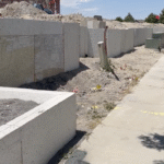 123 Built crew completes installation of foam core retaining wall before exterior finishing
