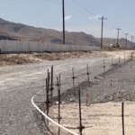 Unfinished EPS foam block wall spanning large apartment development in Grantsville, Utah